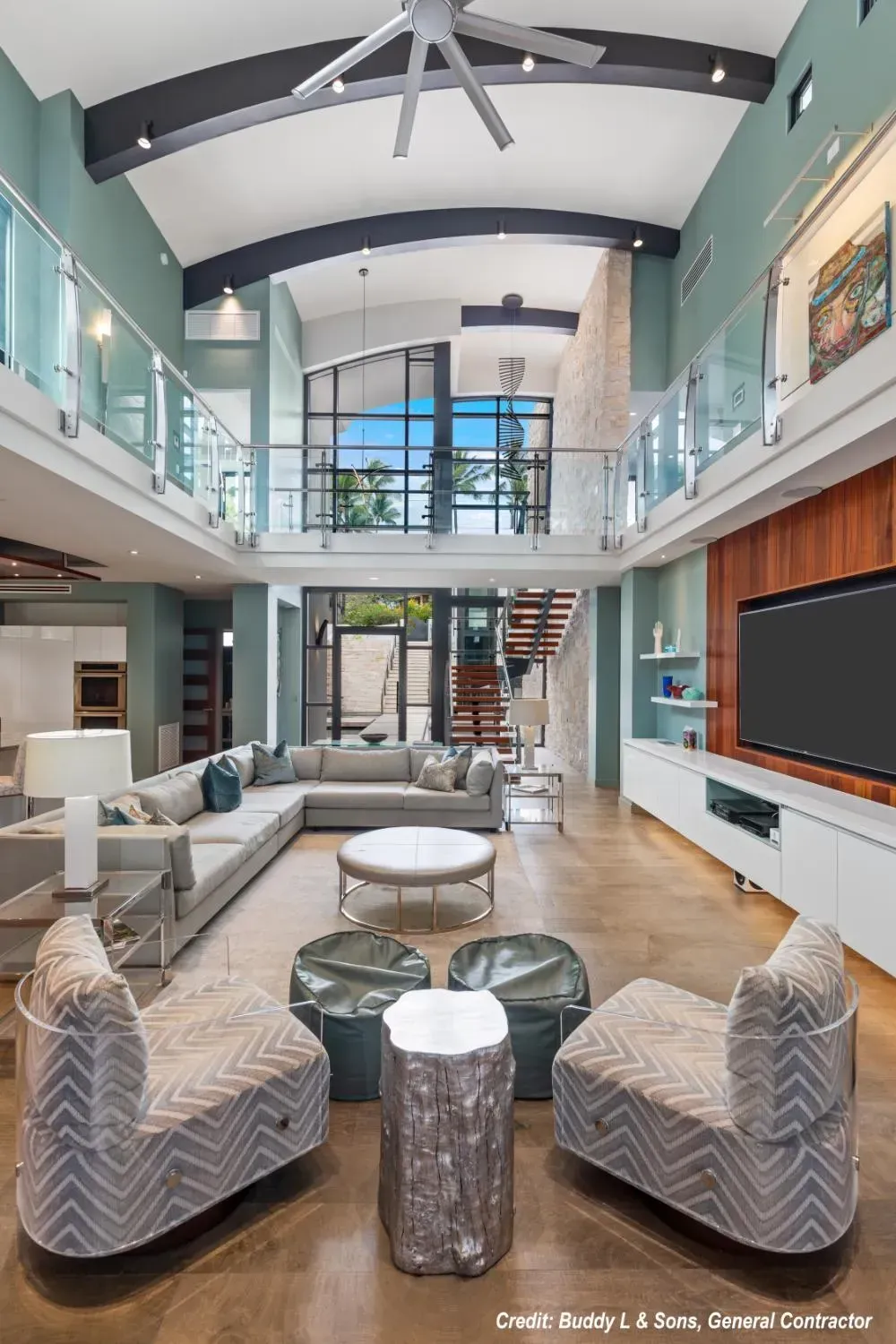 A living room filled with furniture and a flat screen tv.