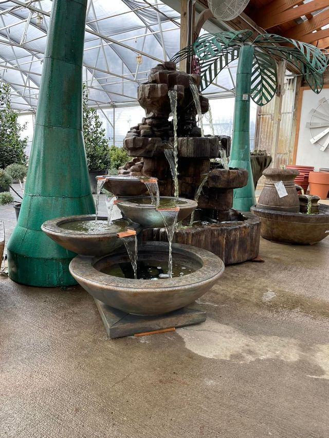 A Row of Fountains Are Lined up In a Greenhouse | Bentonville, AR | Bogle's Garden City