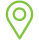 A green pin icon with a circle in the middle on a white background.