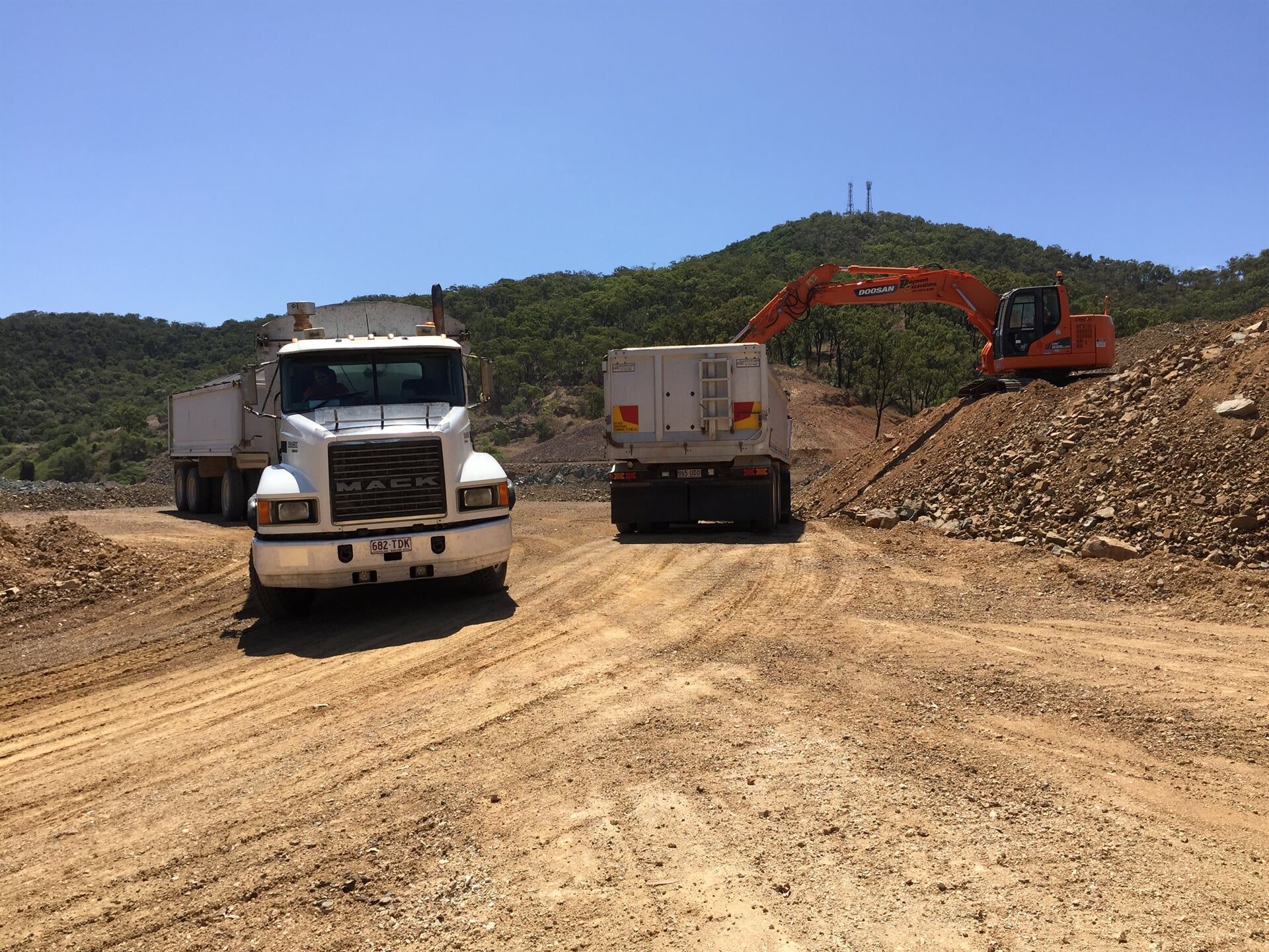 Trucks in quarry - Landscaping & excavating Gladstone