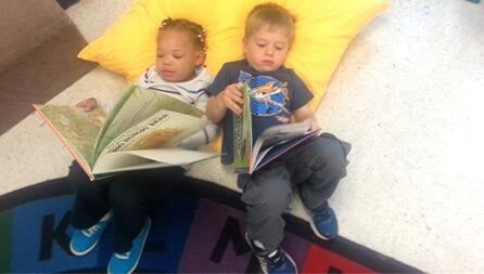 Baby Boys Reading Books — Potomac, MD — Little Acorns Early Learning Center