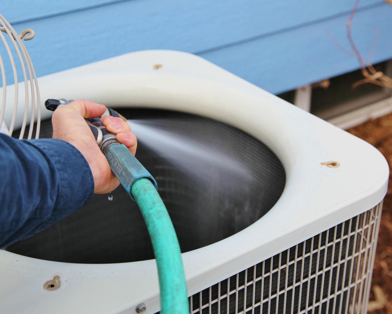 Cleaning outdoor AC unit with garden hose