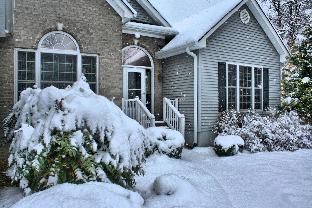 A house with a lot of snow on it