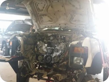 Car without front bumper and visible engine | Madden Auto Repair