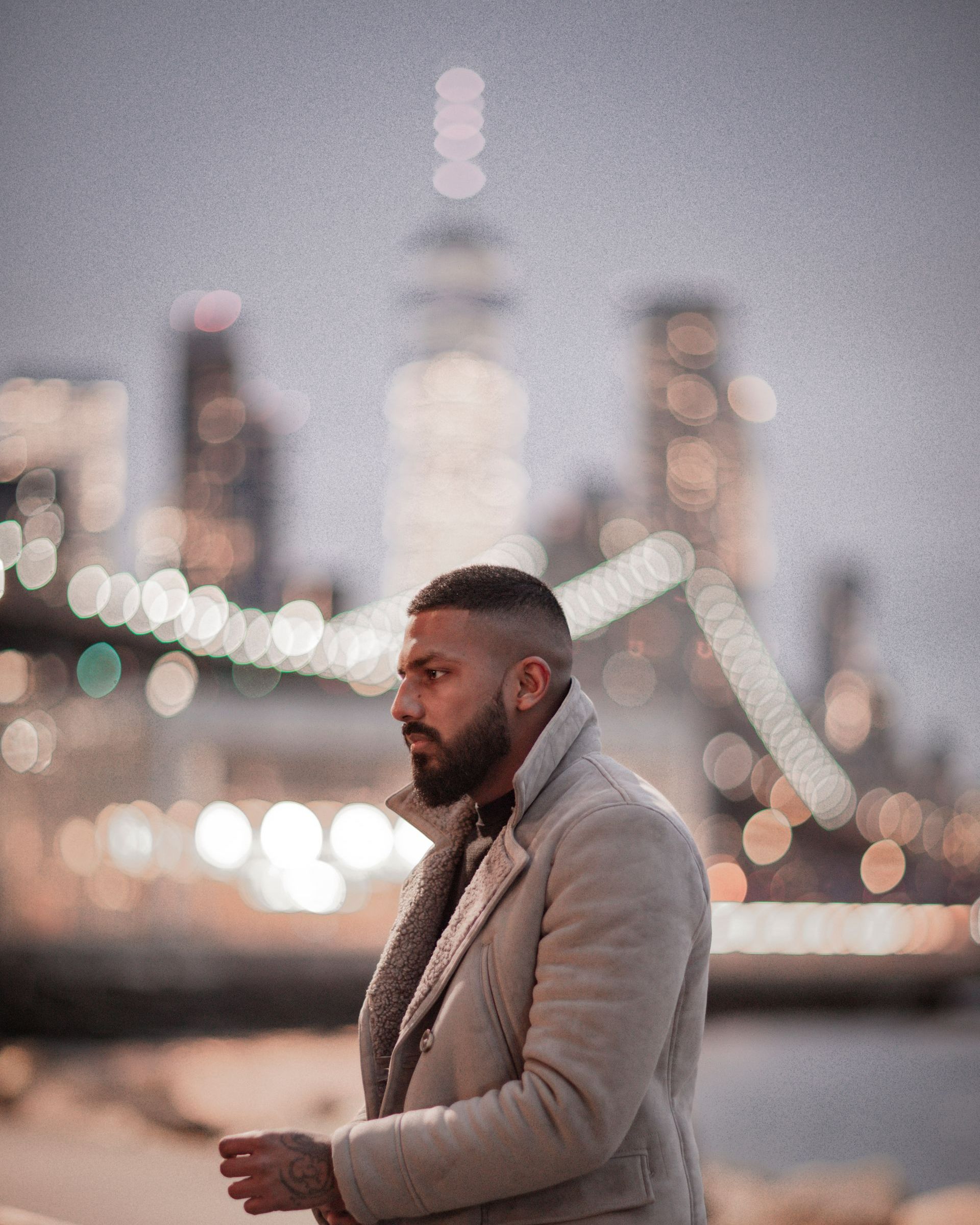 A side profile of a male with a full beard