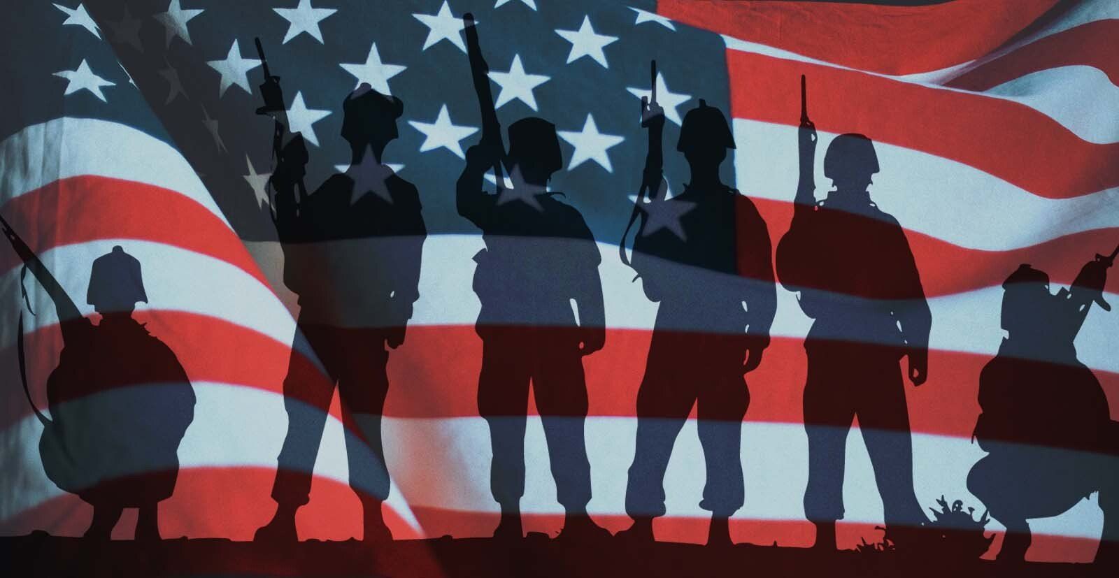 A group of soldiers standing in front of an american flag