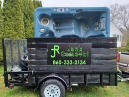 A hot tub is sitting on top of a trailer.