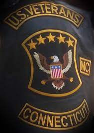 A close up of a u.s. veterans connecticut patch on a jacket.