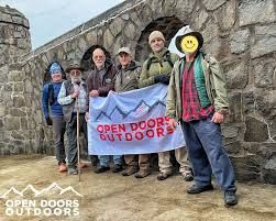 The logo for the new york outdoor rx coalition shows a mountain and a river.