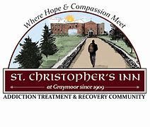 The logo for st. christopher 's inn addiction treatment and recovery community shows a man walking down a path.