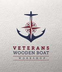 A logo for veterans wooden boat workshop with an anchor and compass.