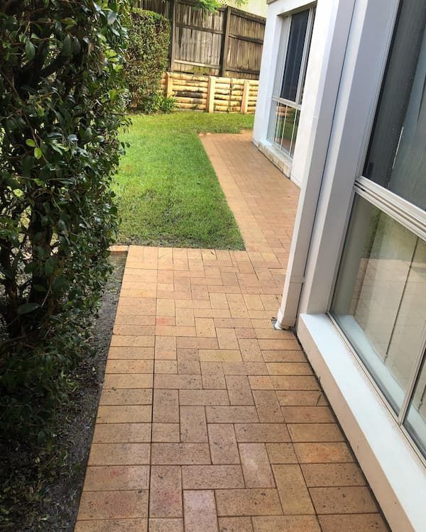 Backyard With a Brick Walkway — Excess Cleaning in Mudgeeraba, QLD