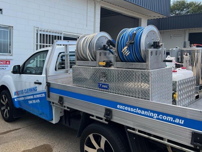 Truck With Hose and Cleaning Tools — Excess Cleaning in Molendinar, QLD