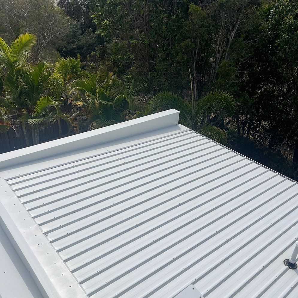 A White Roof With Trees in the Background — Excess Cleaning in Robina, QLD
