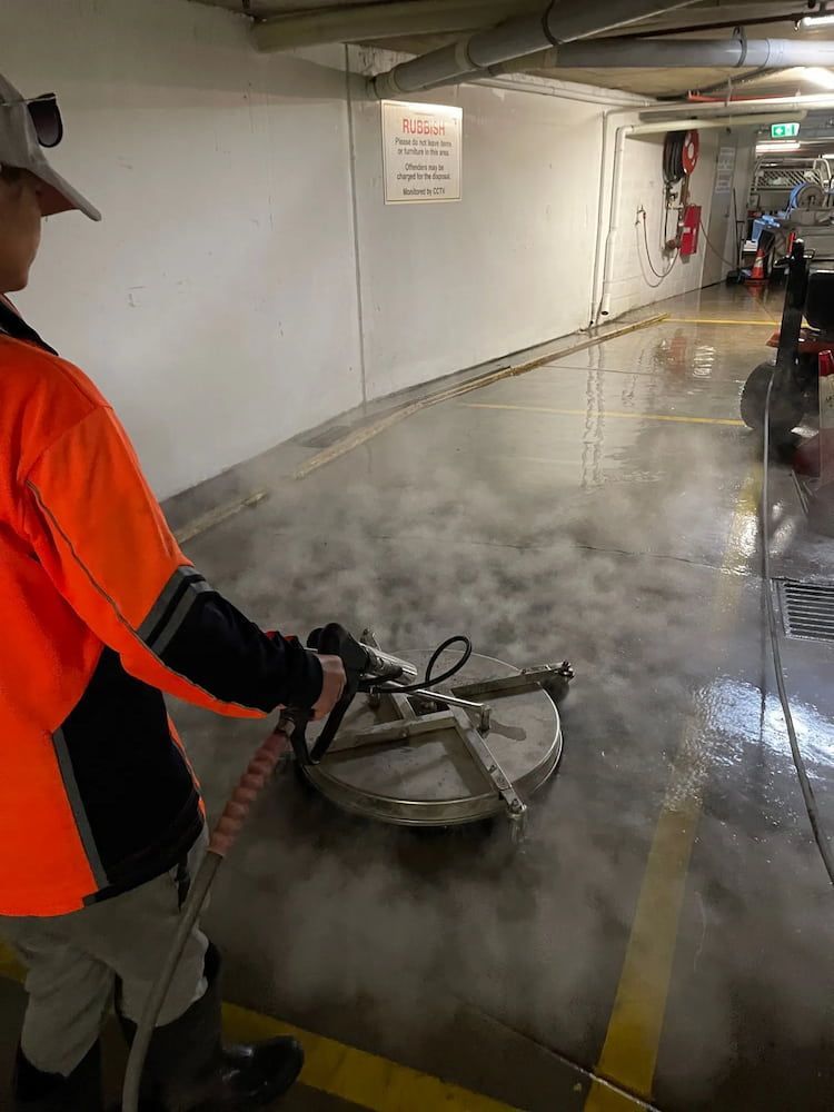 Man Cleaning the Exterior Wall of an Apartment — Excess Cleaning in Molendinar, QLD