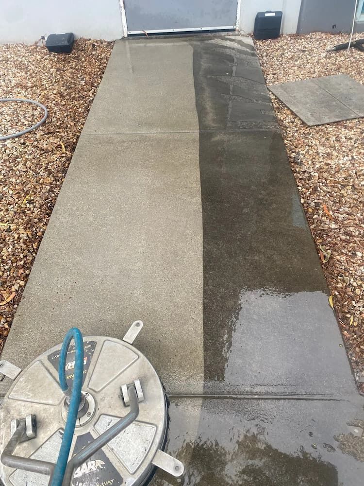 Pressure Washer Machine on Concrete Path — Excess Cleaning in Molendinar, QLD