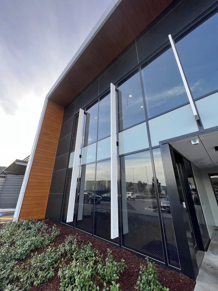 Men Cleaning the Exterior of a Building — Excess Cleaning in Molendinar, QLD