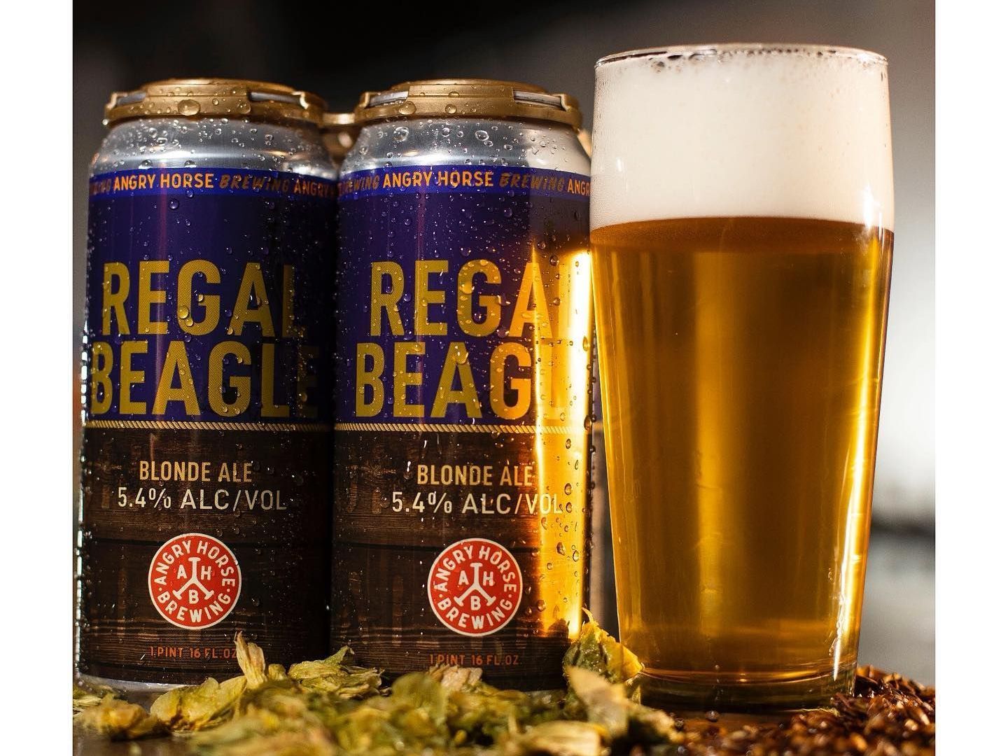 cans and a glass of regal beagle craft beer