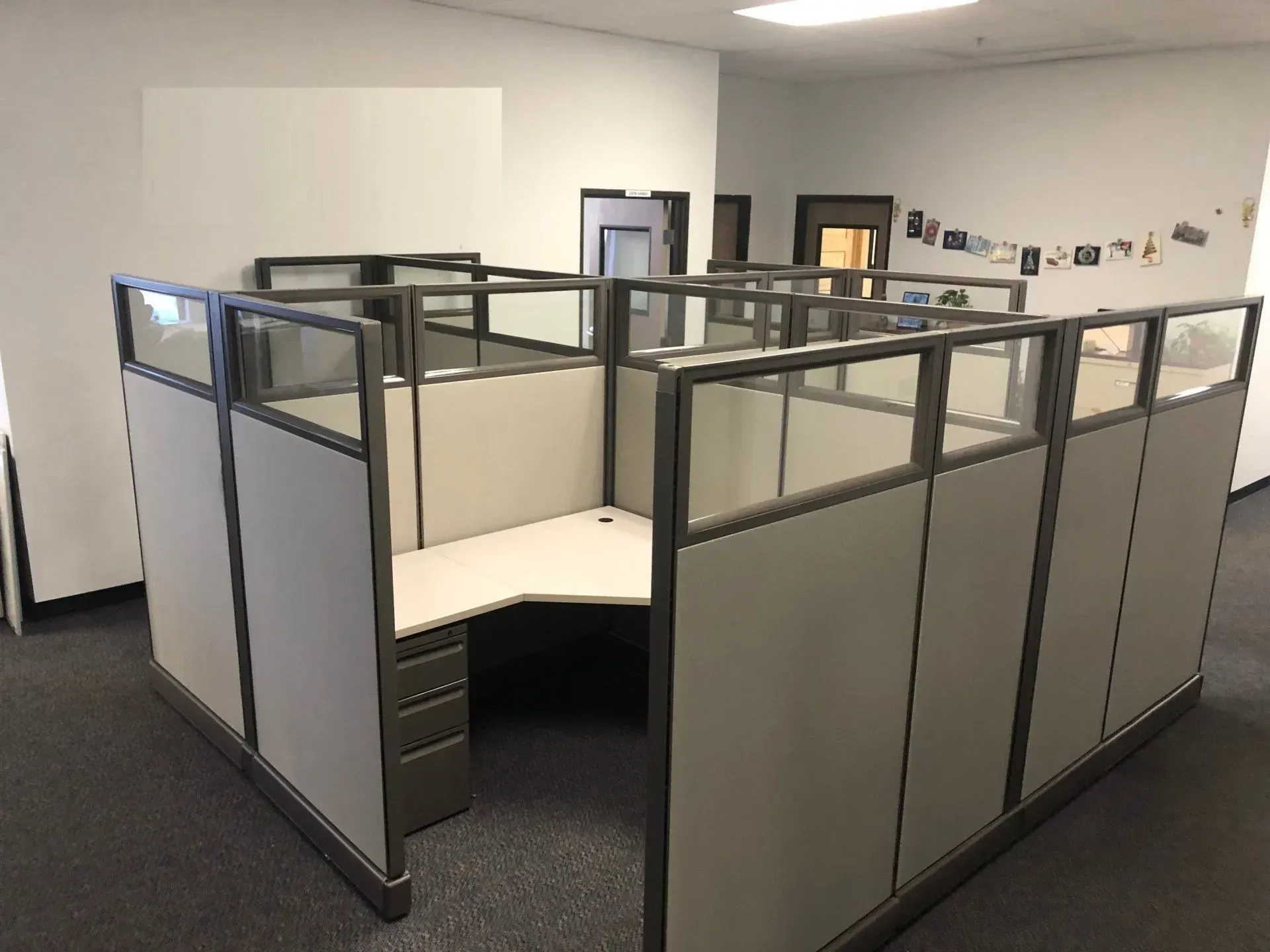 An empty office with cubicles and a desk