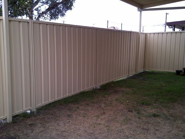 Beige color bond fencing in backyard — SMH Valley Fencing & Maintenance In Millfield, NSW