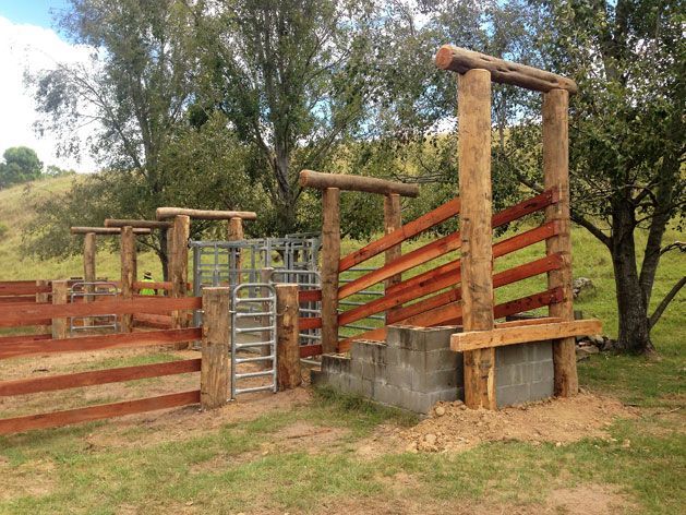 A Wooden Fence With a Gate in the Middle of a Grassy Field — SMH Valley Fencing & Maintenance In Millfield, NSW