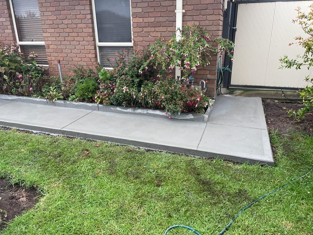 Durable concrete path installed surrounding a residential property in Sunshine VIC.