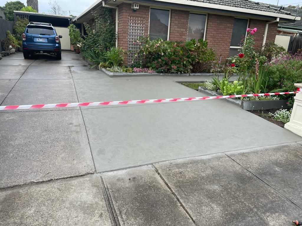 A recently constructed residential concrete driveway of a property in Sunshine VIC.