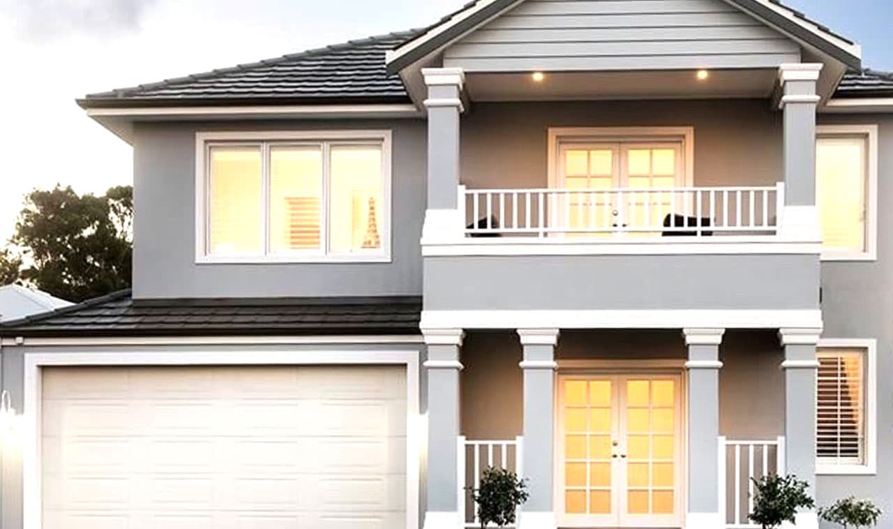 Exterior shot of a stunning home in Perth with a unique colour scheme that stands out in the neighbourhood. Expert exterior styling in Perth is evident with the complementary landscaping and design elements.