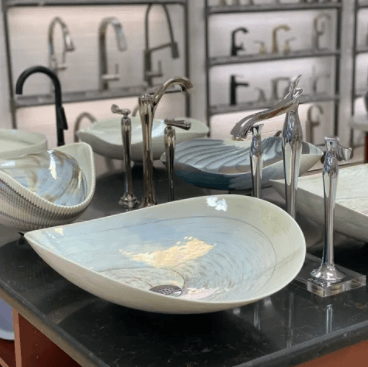 Man Tightening A Screw Below The Sink