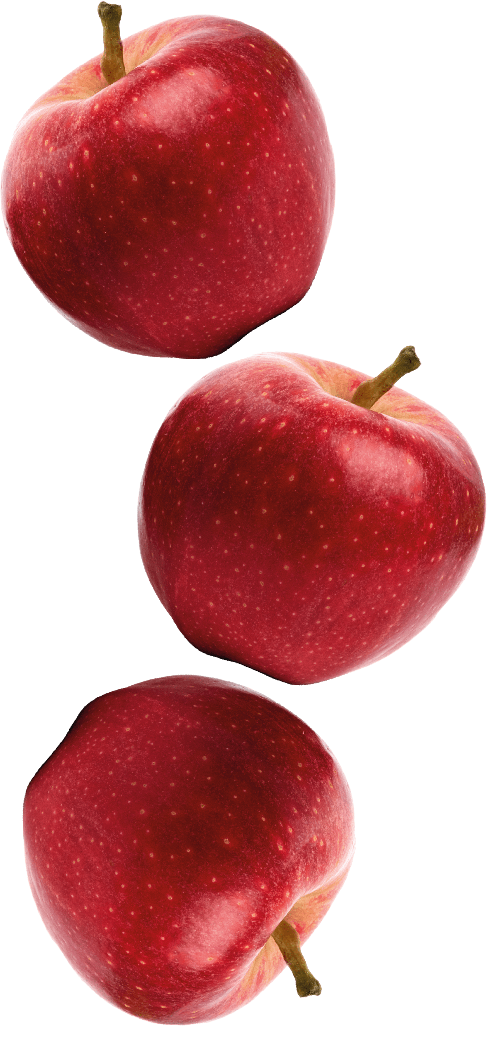 Tre mele rosse sono impilate una sopra l'altra su uno sfondo bianco