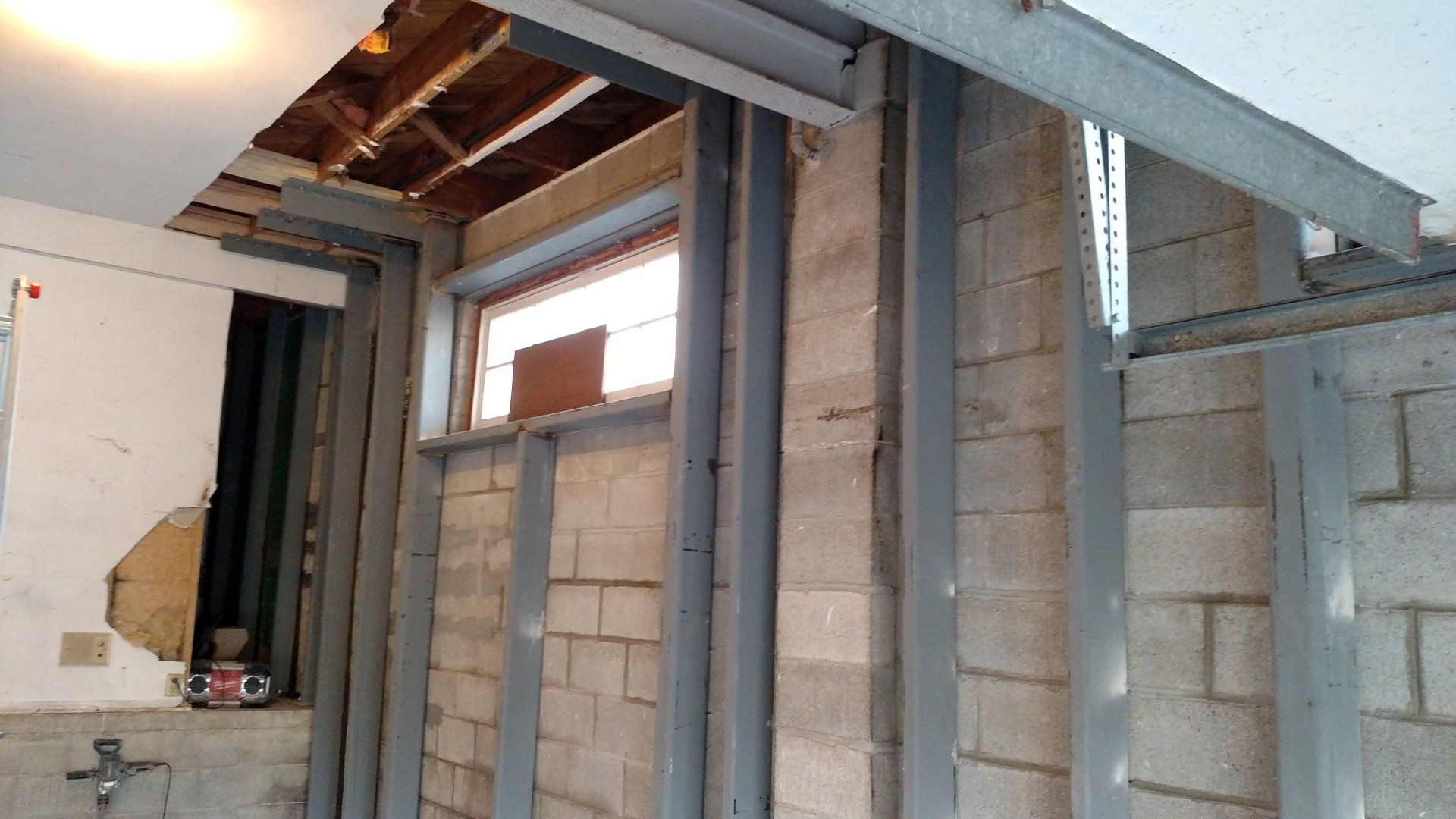 glass block windows A room with a brick wall and a window.