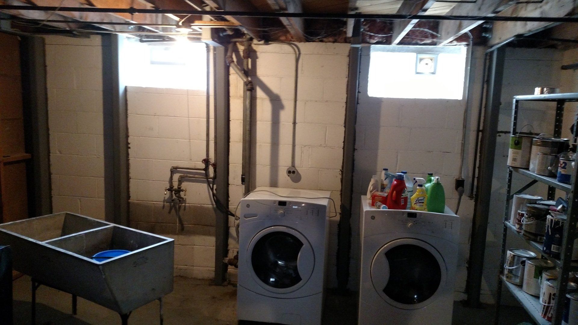 musty smell in basement A laundry room with two washers and a sink