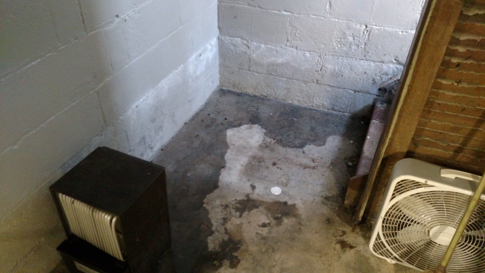 basement and foundation repair A room with a fan and a speaker in it.