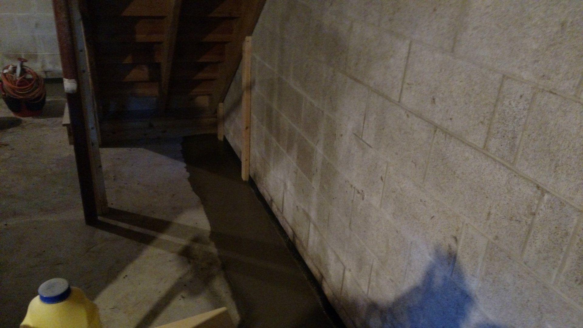 basement leaks repair near me A bottle of milk is sitting next to a brick wall in a basement.