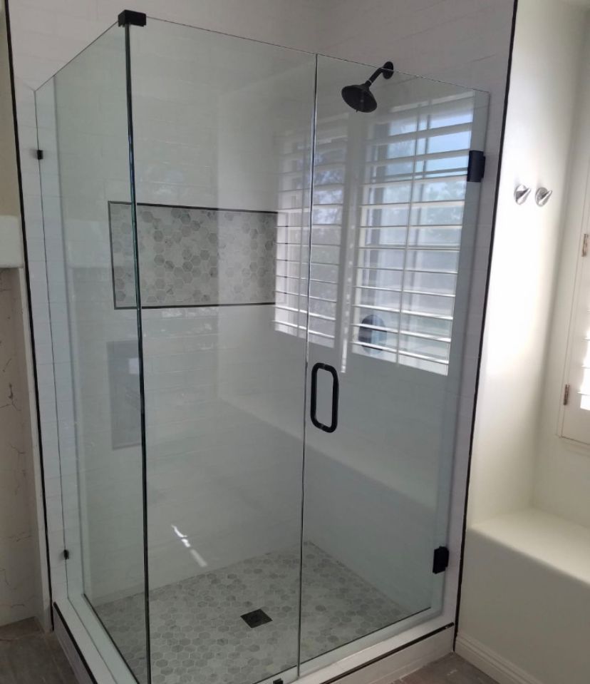 A Bathroom with A Shower and A Window with Shutters - New Orleans, LA - The Clear Choice