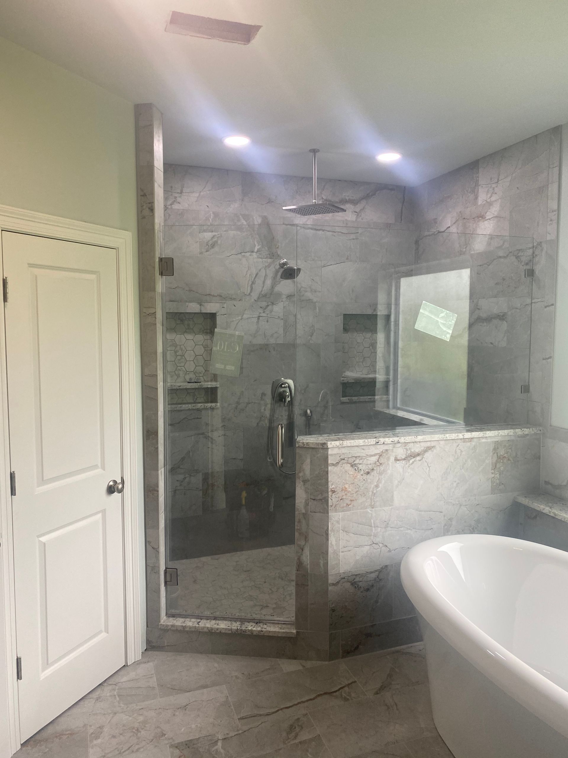 A Bathroom with A Tub and A Walk in Shower - New Orleans, LA - The Clear Choice