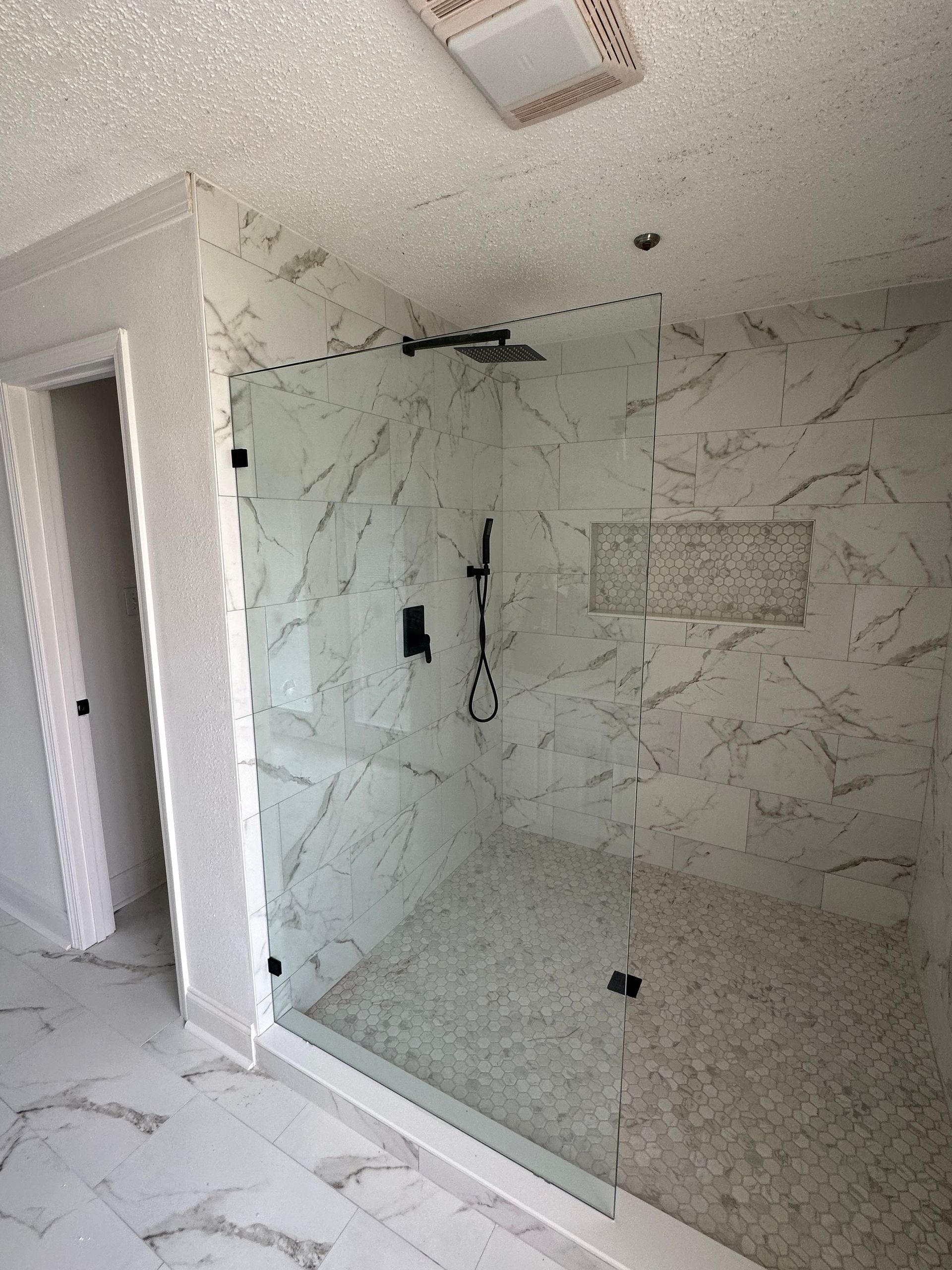A Bathroom with A Walk in Shower with A Glass Door - New Orleans, LA - The Clear Choice