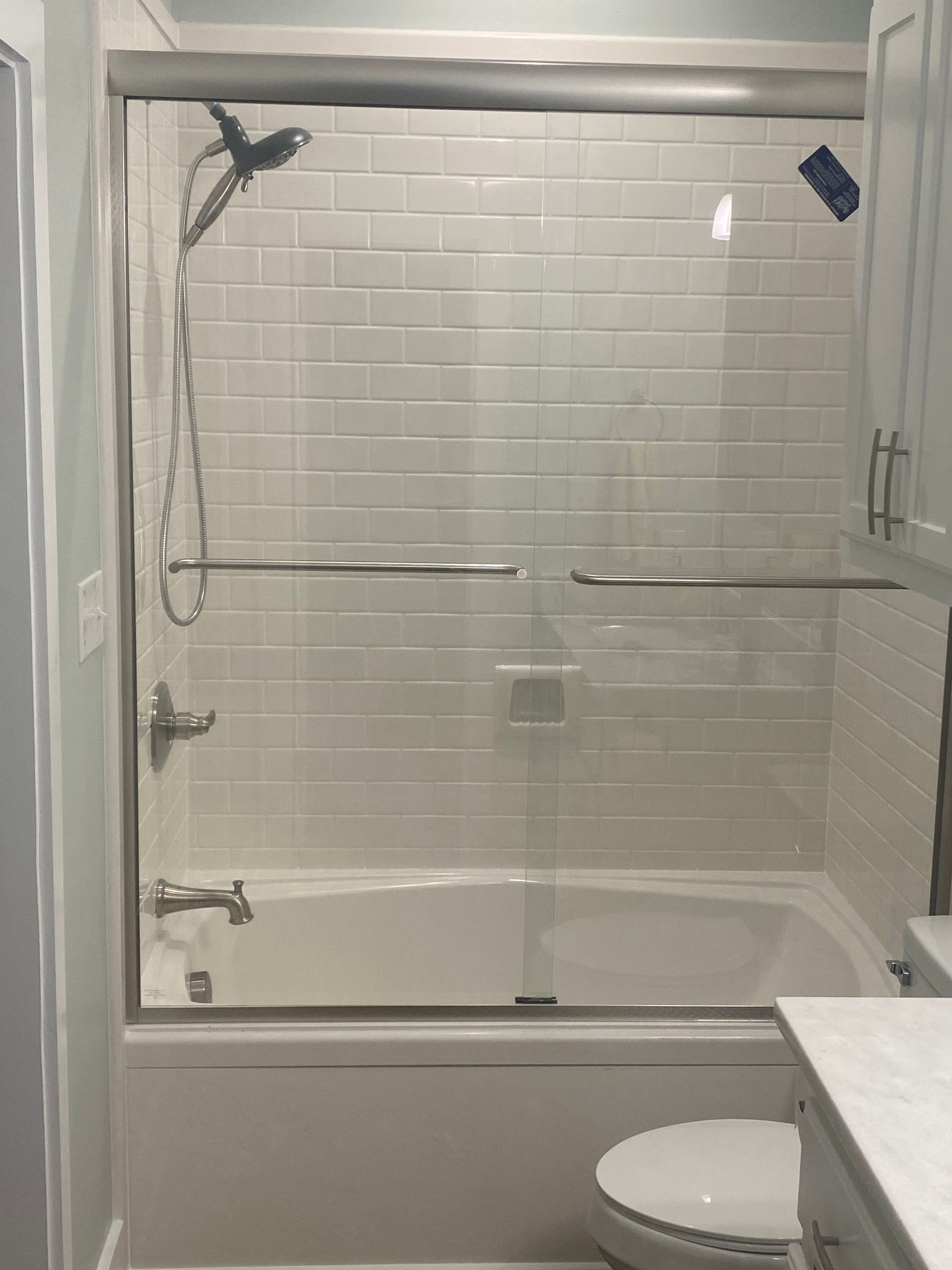 A Bathroom with A Bathtub, Toilet, Shower and Sliding Glass Door - New Orleans, LA - The Clear Choice