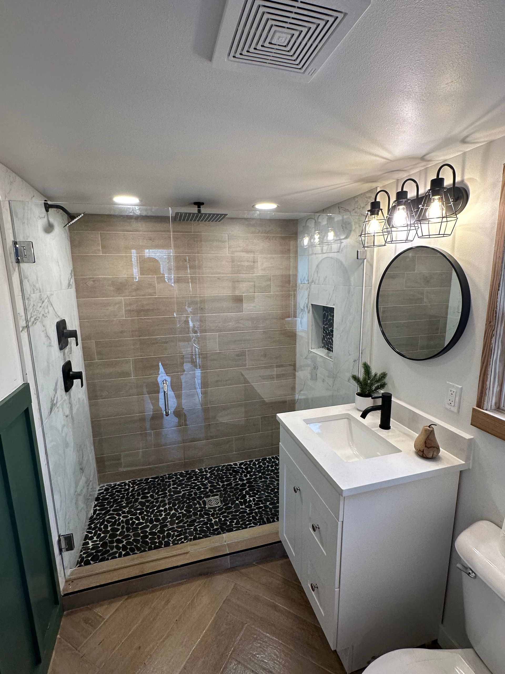 A Bathroom with A Walk in Shower, Sink, Toilet and Mirror - New Orleans, LA - The Clear Choice