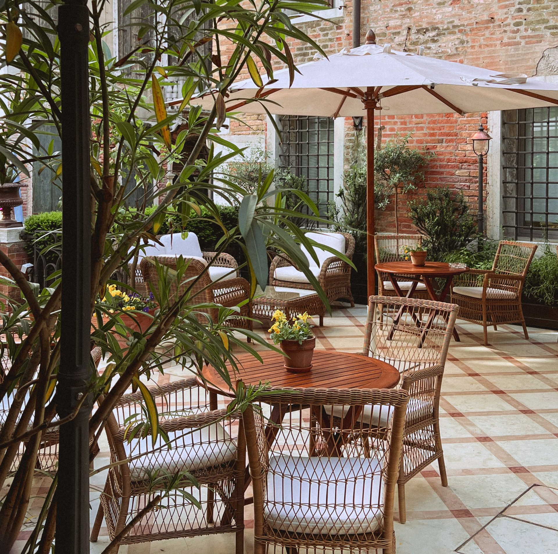 outdoor tables and chairs on a backyard