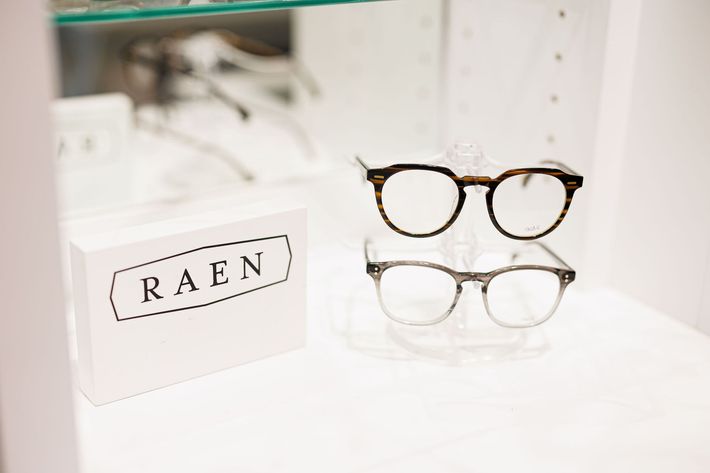 A table with glasses and sunglasses on it.