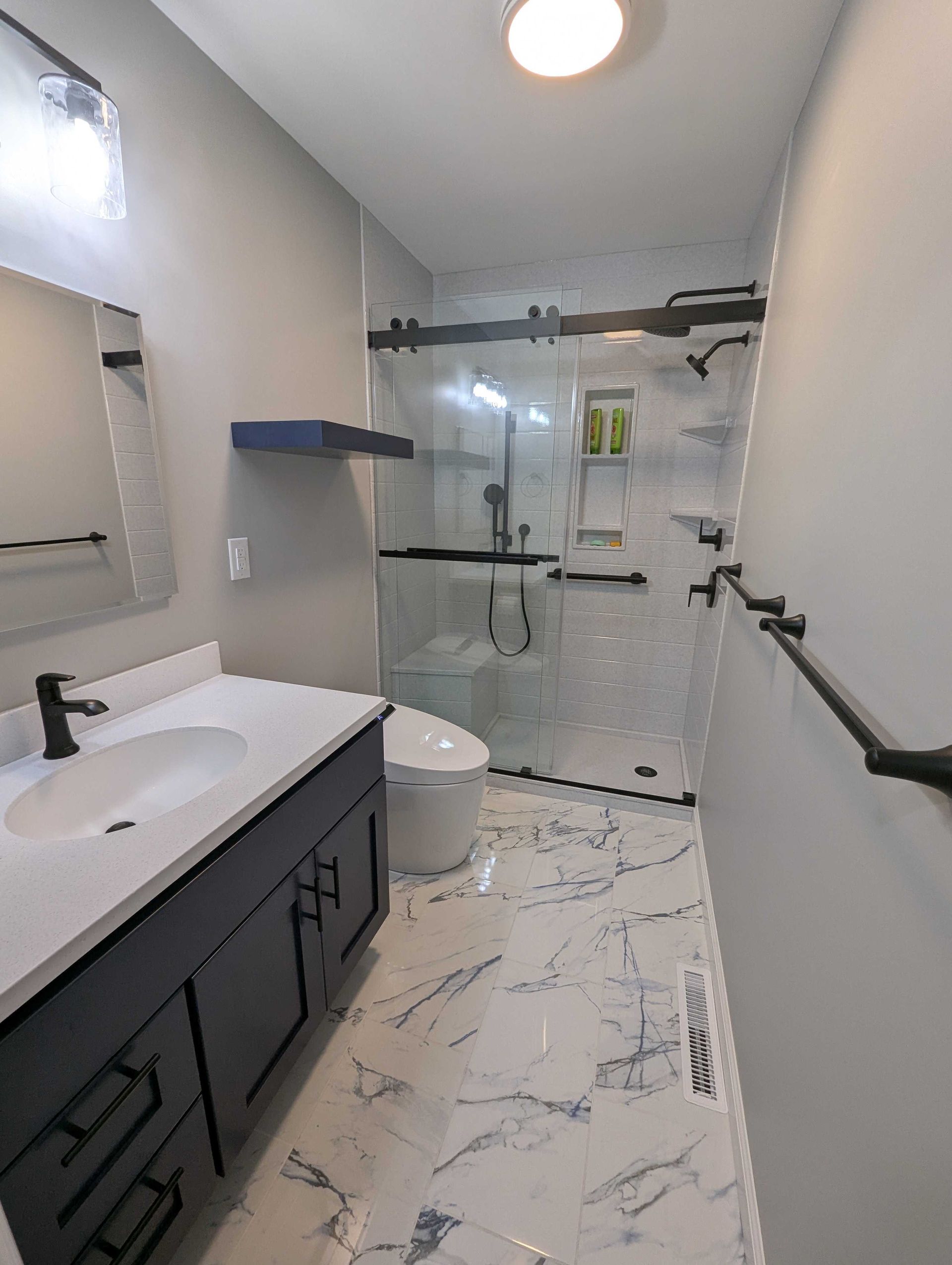 full bathroom remodel with new shower, bathroom cabinets and marble floors