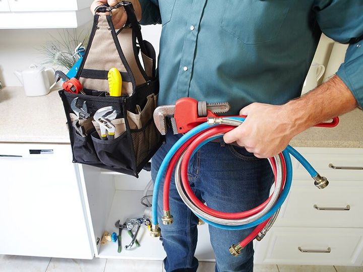 Plumber Carrying Tools — Rob Powell Plumbing in Coraki, NSW
