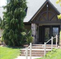 A house with stairs leading up to the front door