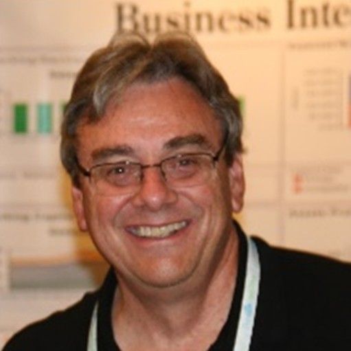 A smiling headshot for the bio of steve peterson