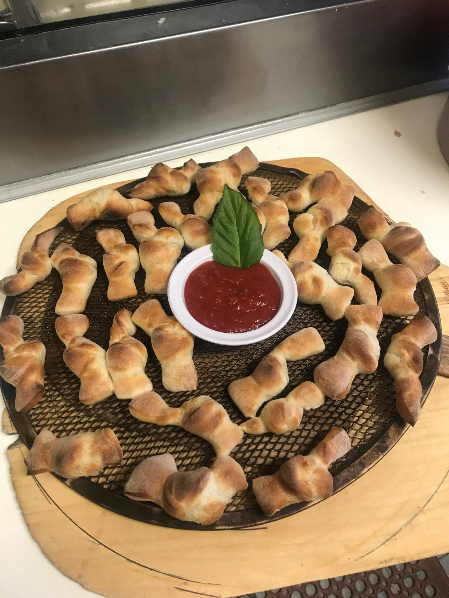A plate of food with a bowl of ketchup on it