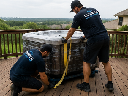 Jacuzzi movers carefully loading spa for secure truck transport