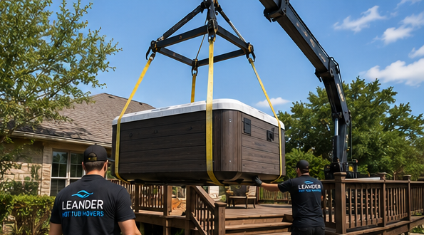 Workers guiding spa onto moving dolly for safe transport