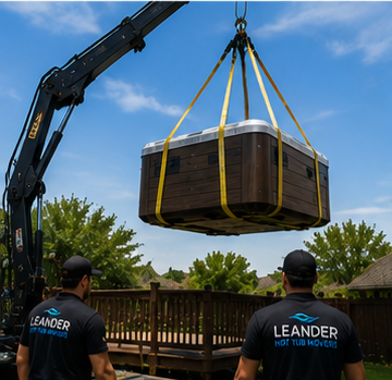 Crane service lifting spa over fence during backyard access job