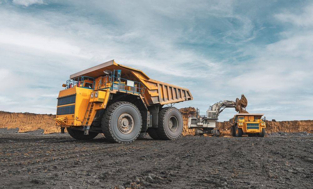 Yellow Mining Truck and Excavator in a Coal Mine — Compass Equipment Hire in Iluka, NSW